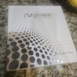 Numiere Plus Beauty Device Packaging - White and Silver